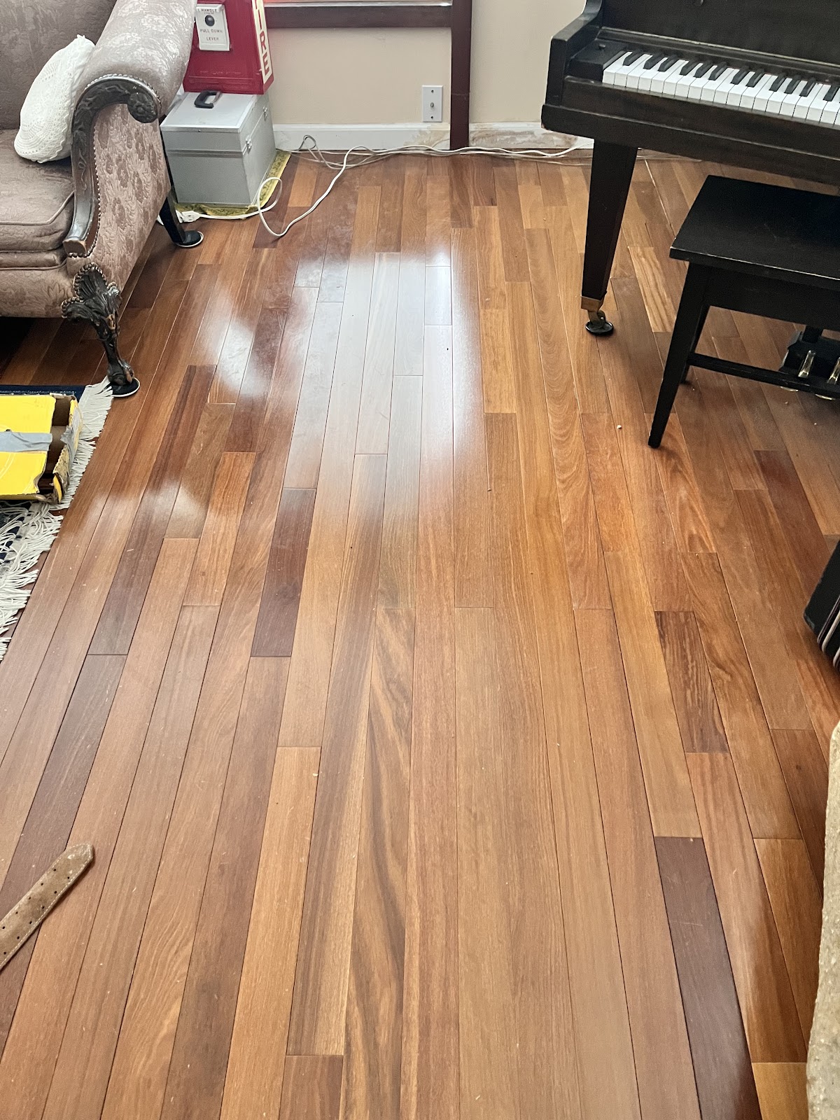 Refinished hardwood floor restored to a clean even surface after repair
