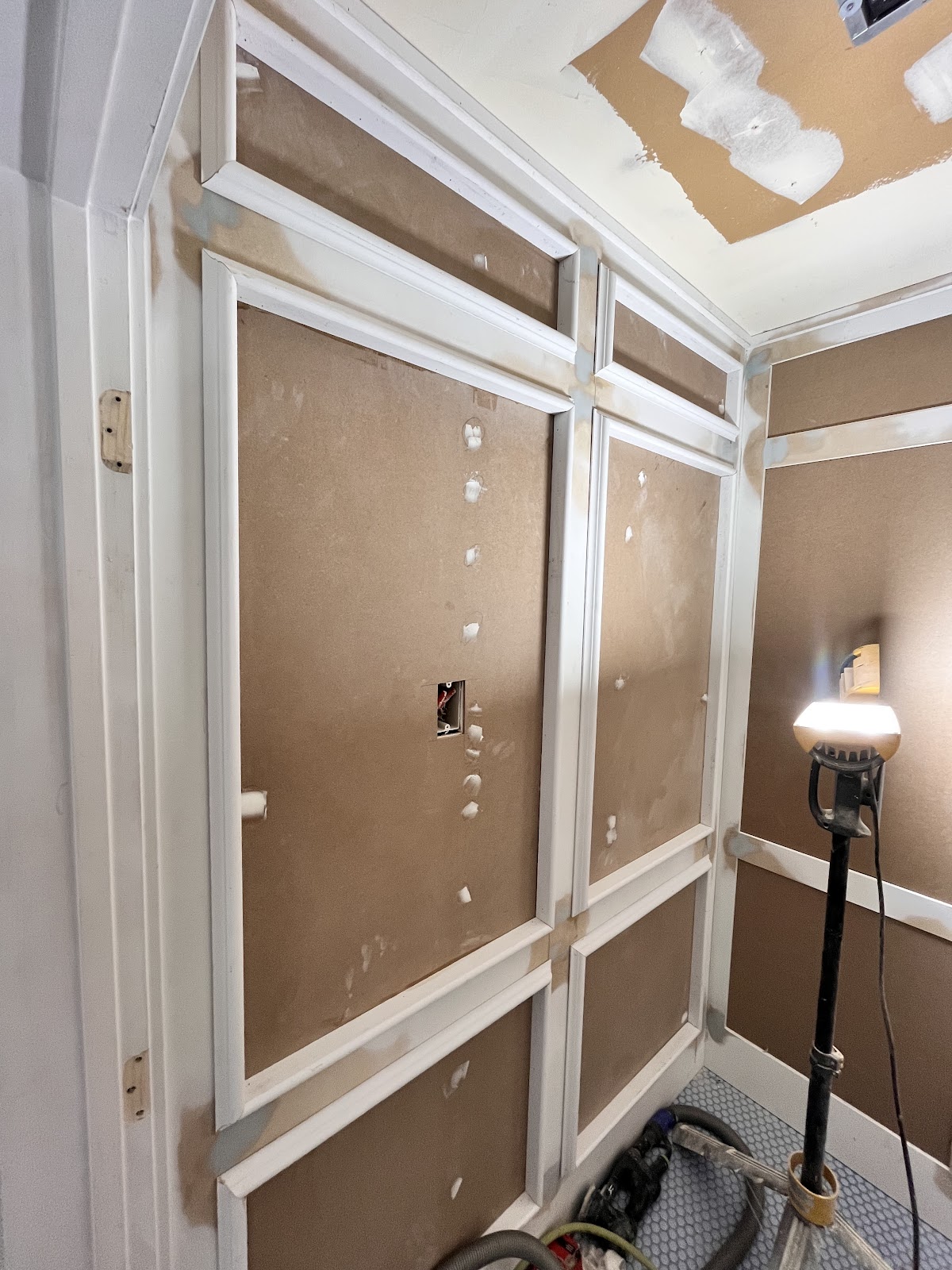 Wainscoting and panel molding installed by Elm Crafted, work in progress