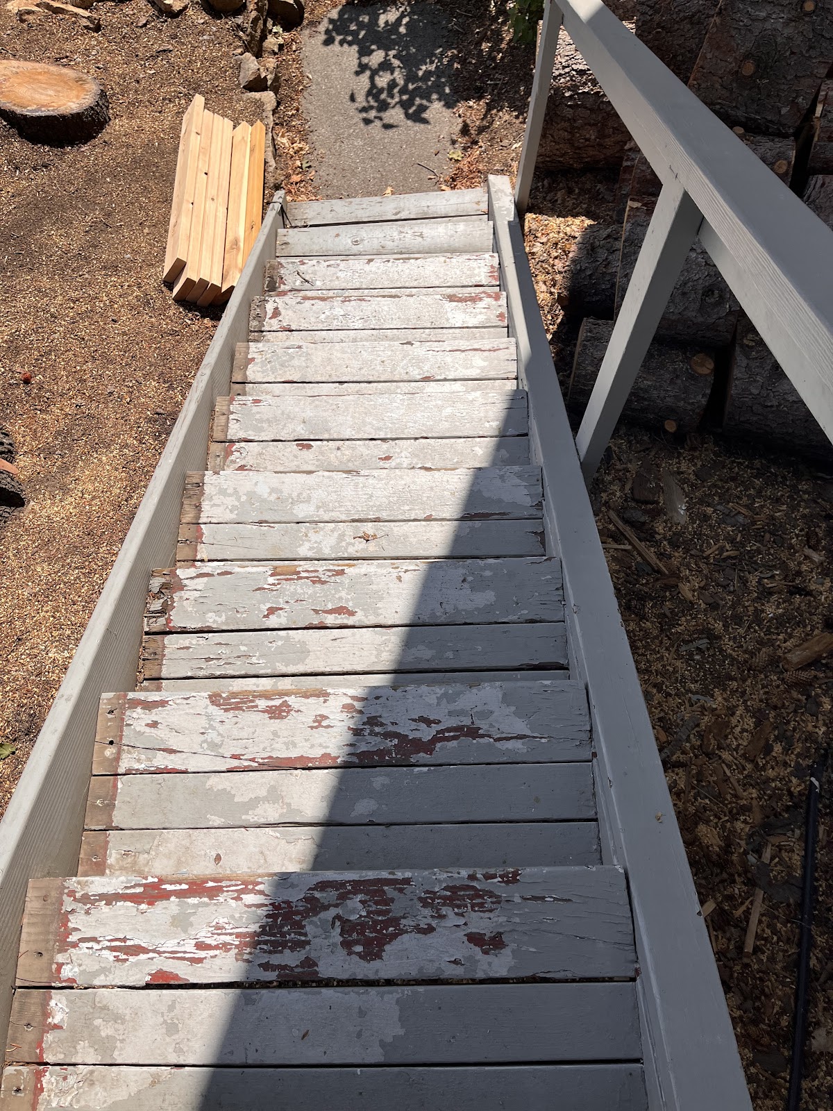 Exterior wood stair and ramp restoration with fresh framing